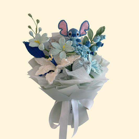 Bouquet with knitted blue elephants and flowers on a light beige background