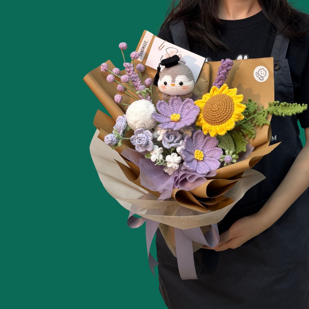 a customised crochet bouquet for graduation with a special grad penguin