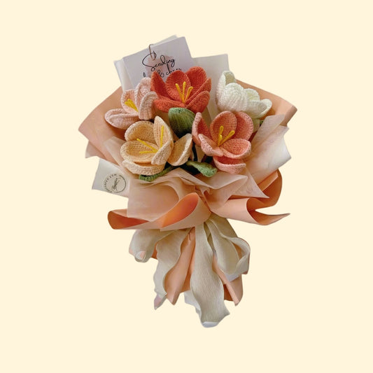 Bouquet of felt flowers with a card on a beige background