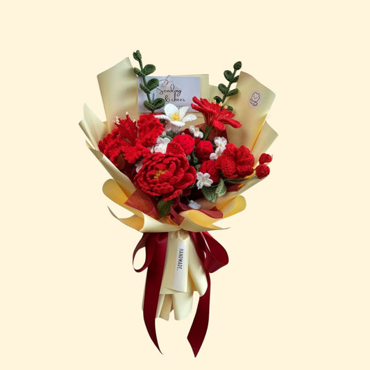 Bouquet of red flowers with a white card on a beige background
