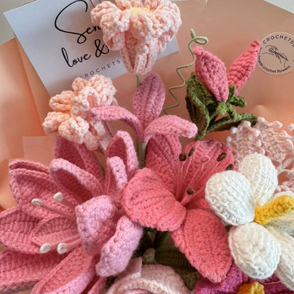 Collection of crocheted flowers with a card in the background