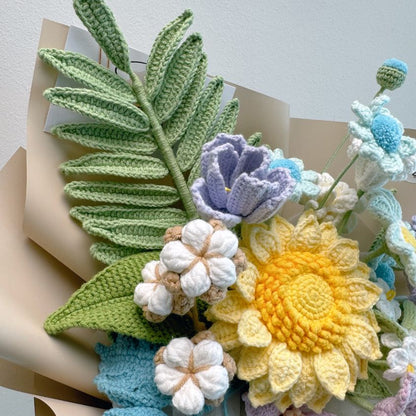 Crocheted flowers and leaves on a neutral background