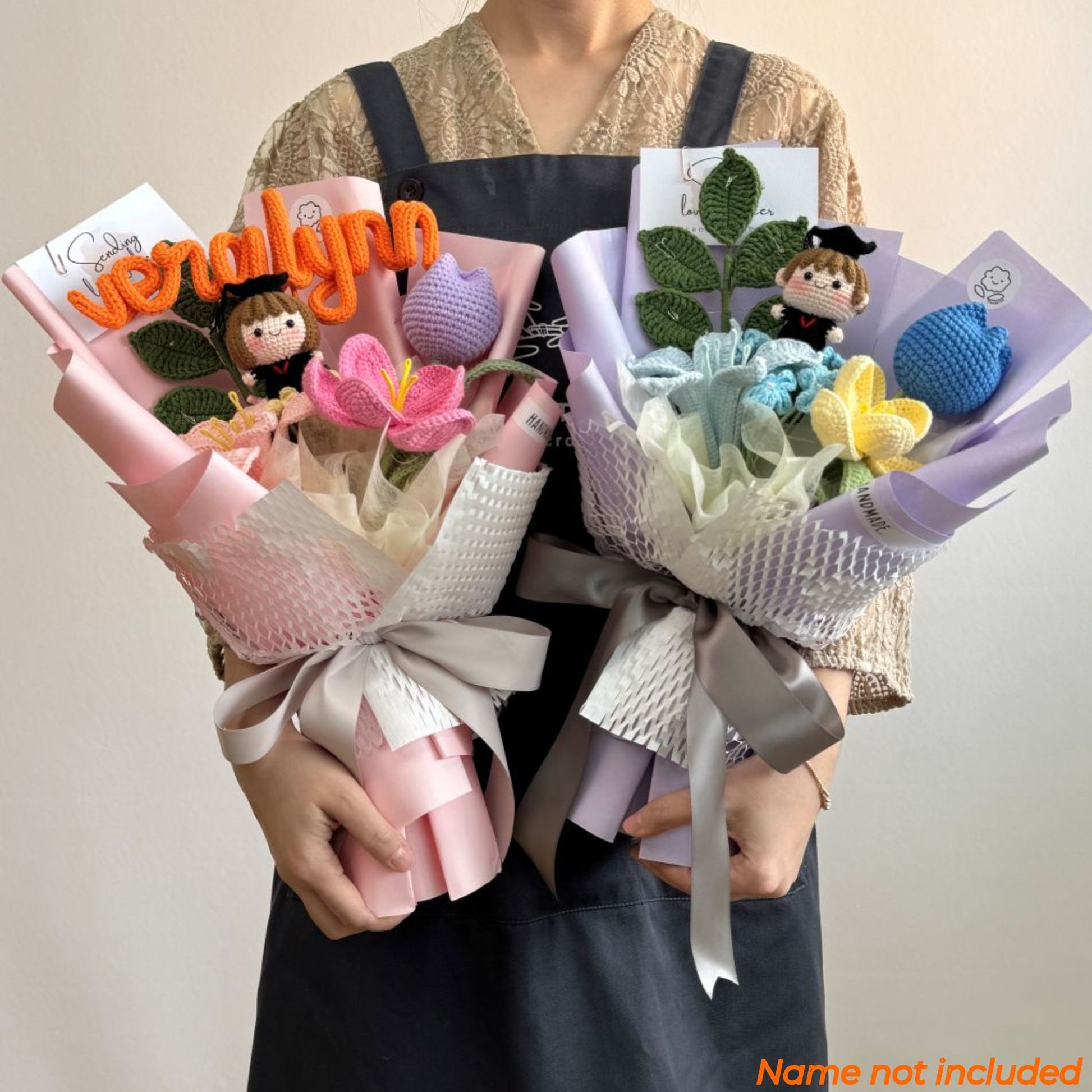 Two bouquets of knitted toys held by a person against a plain background.